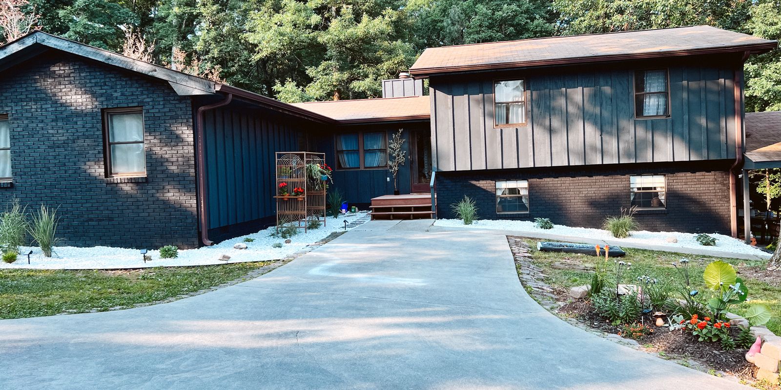 House exterior repainted dark navy and charcoal by Tennessee Painting LLC
