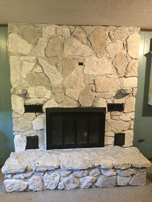 Stone fireplace painted white