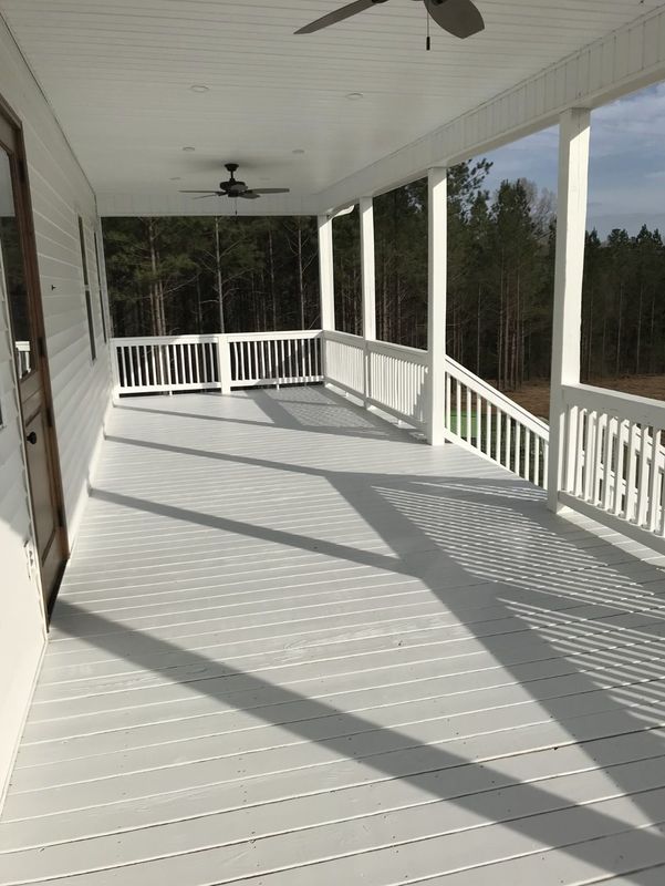Wraparound porch, painted floor and white railings